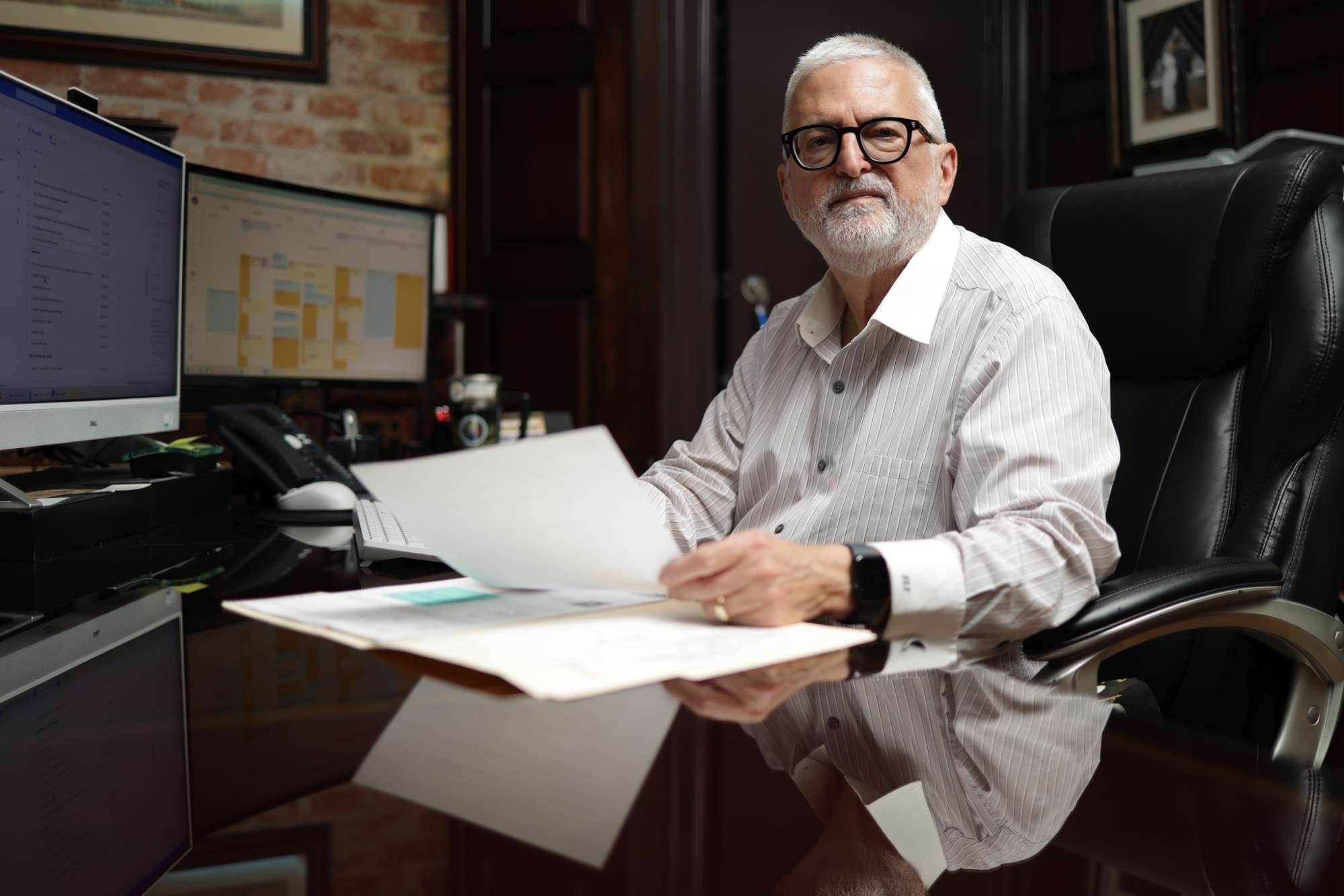 Jeff Fine, owner of AccountMaster, seated at his desk